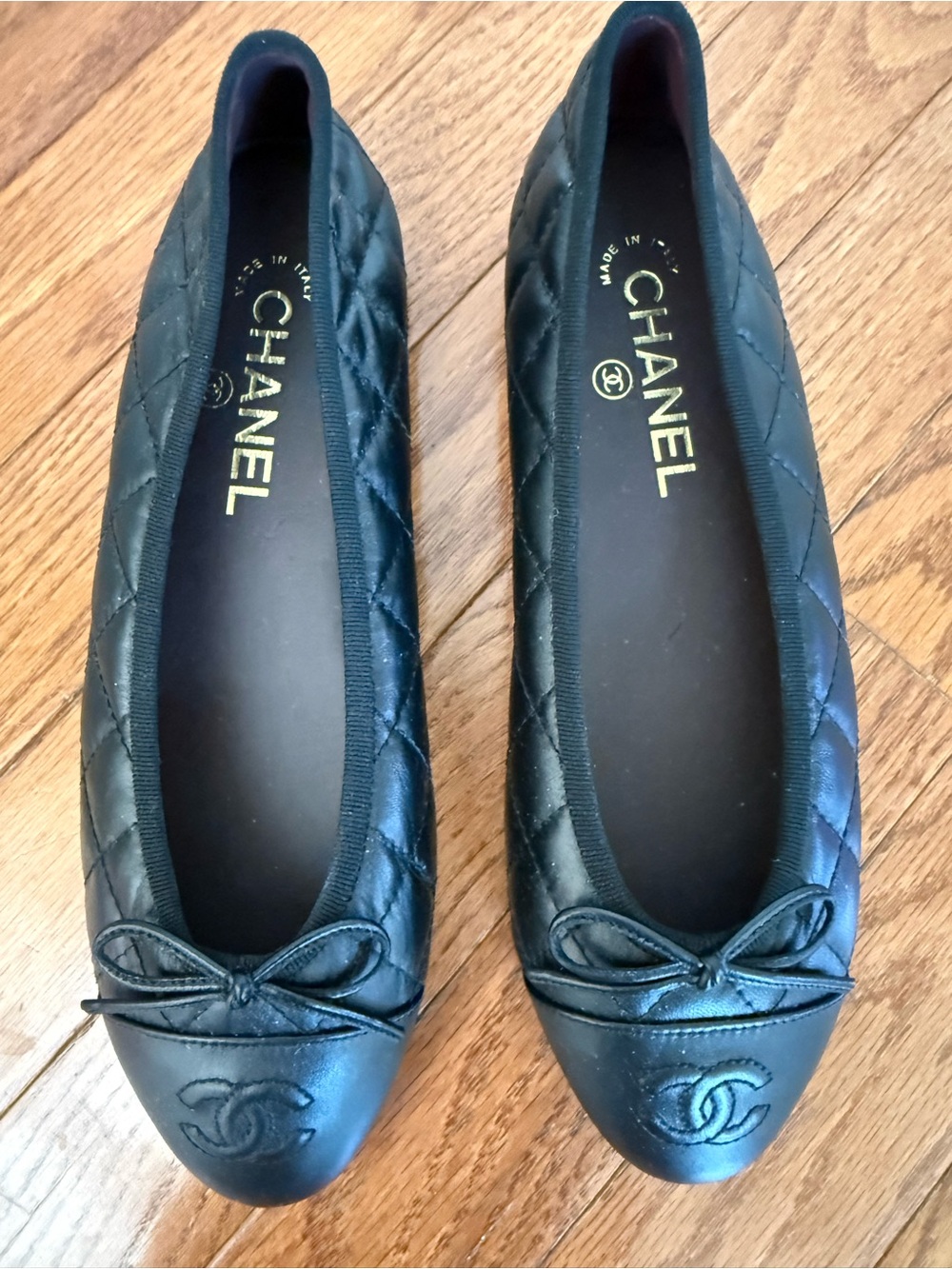 CHANEL Black Quilted Leather Cap-Toe Bow Ballet Flats
